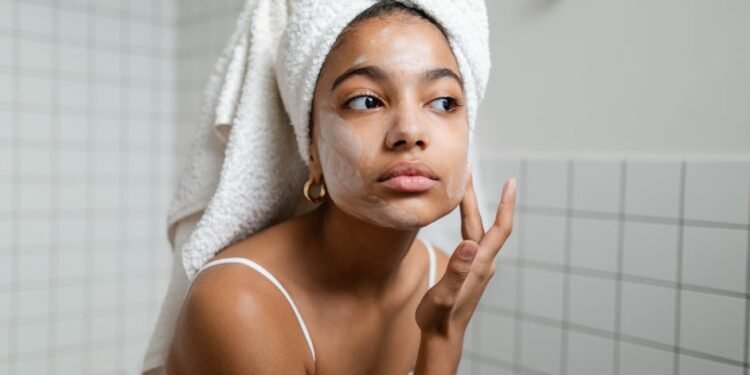 Woman applying gel sunscreen on oily skin with lightweight non-greasy texture